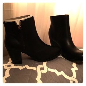 Black booties with gold like hardware
